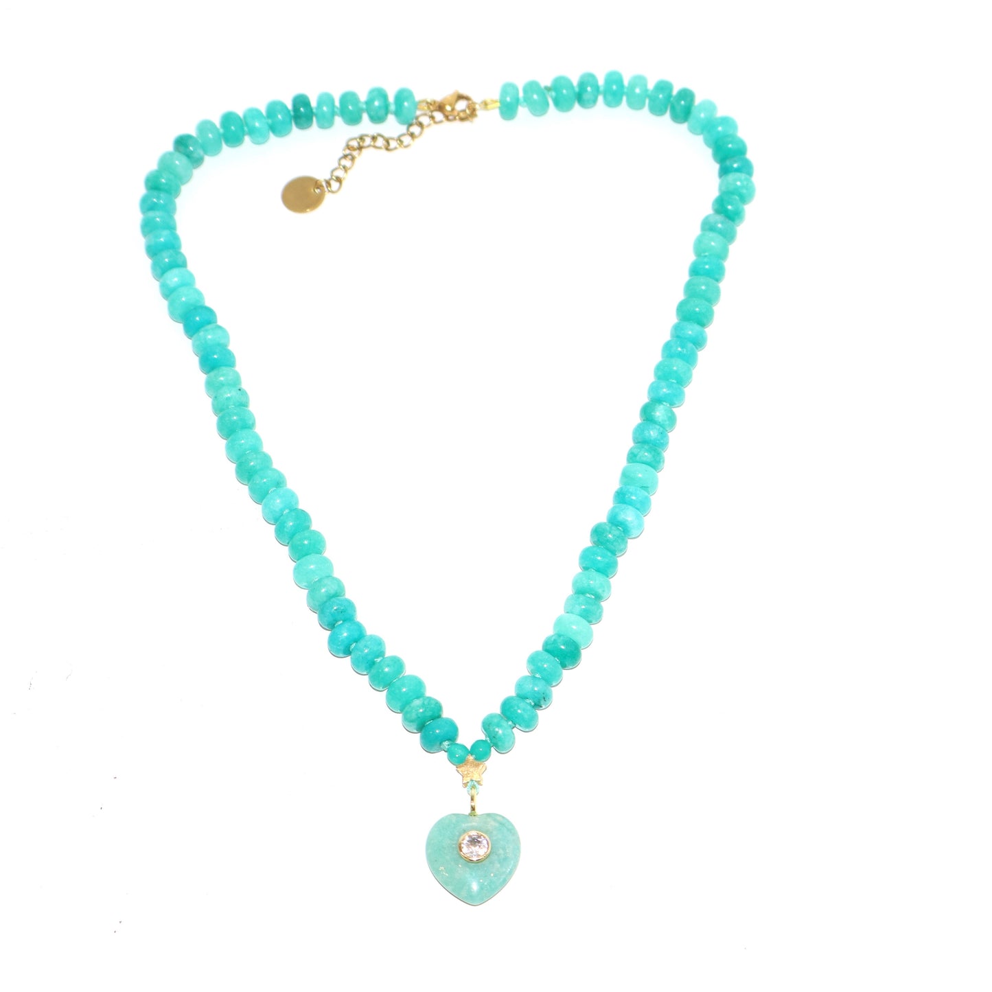 Turquoise beaded necklace with a heart-shaped pendant on a white background