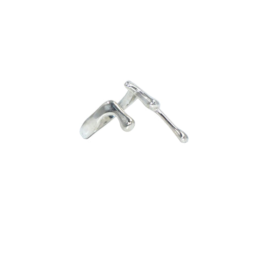 Silver earring on a light gray background